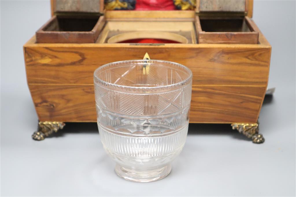 A Regency kingwood sarcophagus tea caddy fitted two containers and a cut glass bowl
